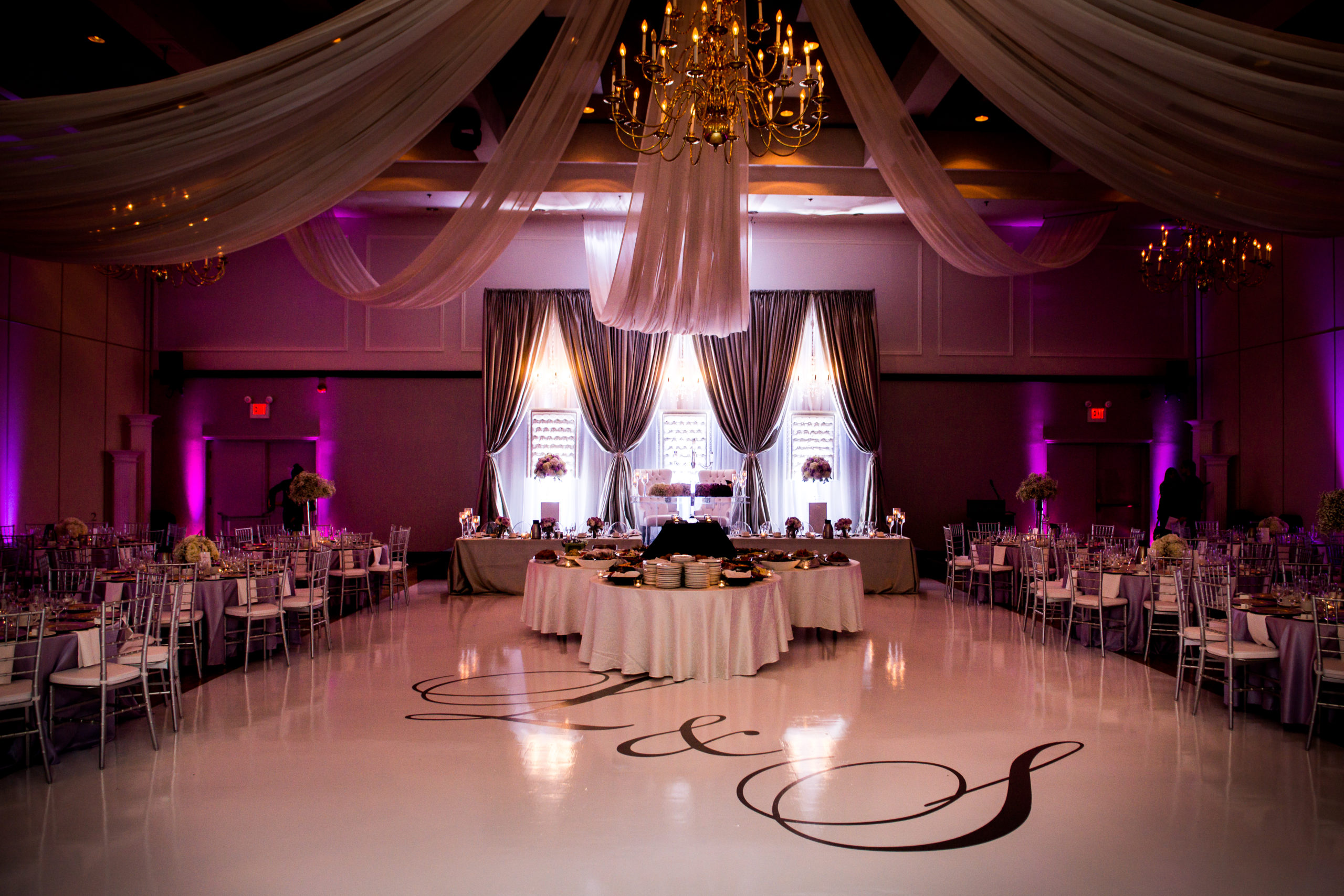 wide angle shot of ballroom with white dance floor at Carmen's