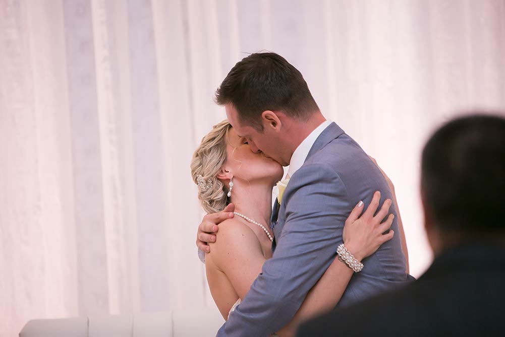 close up of bride and groom kissing