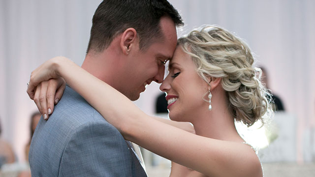 closeup of bride and groom embracing during first dance