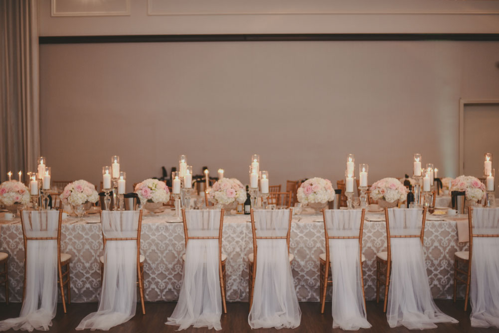 wedding reception decor with chiavari chairs and tulle chair covers