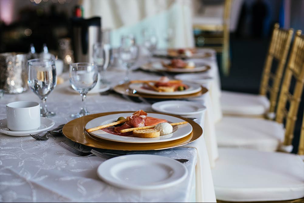 close up of wedding table with plated antipasto