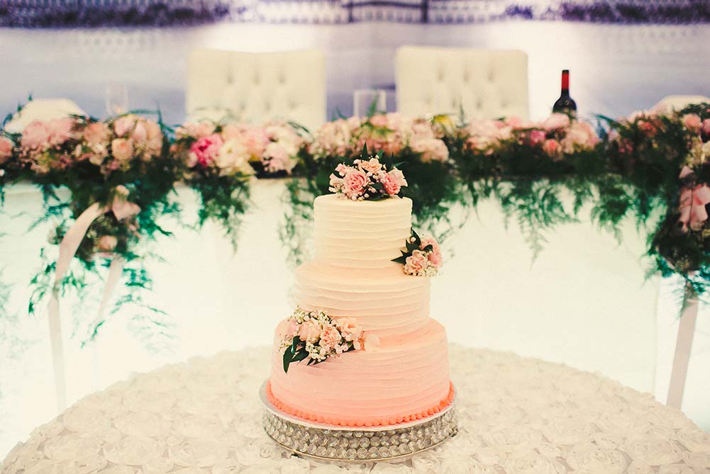 close up of ombre pink wedding cake